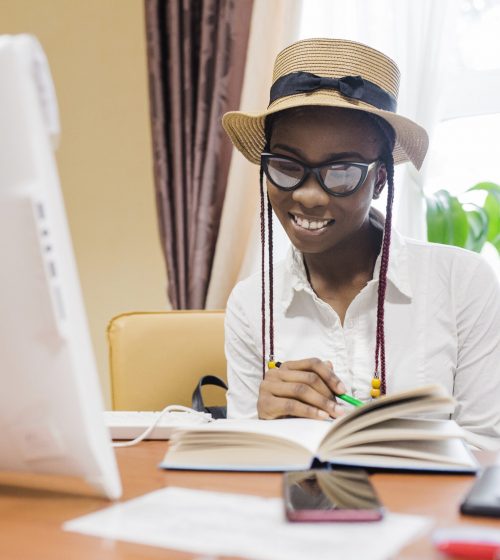 young-black-woman-with-book-table